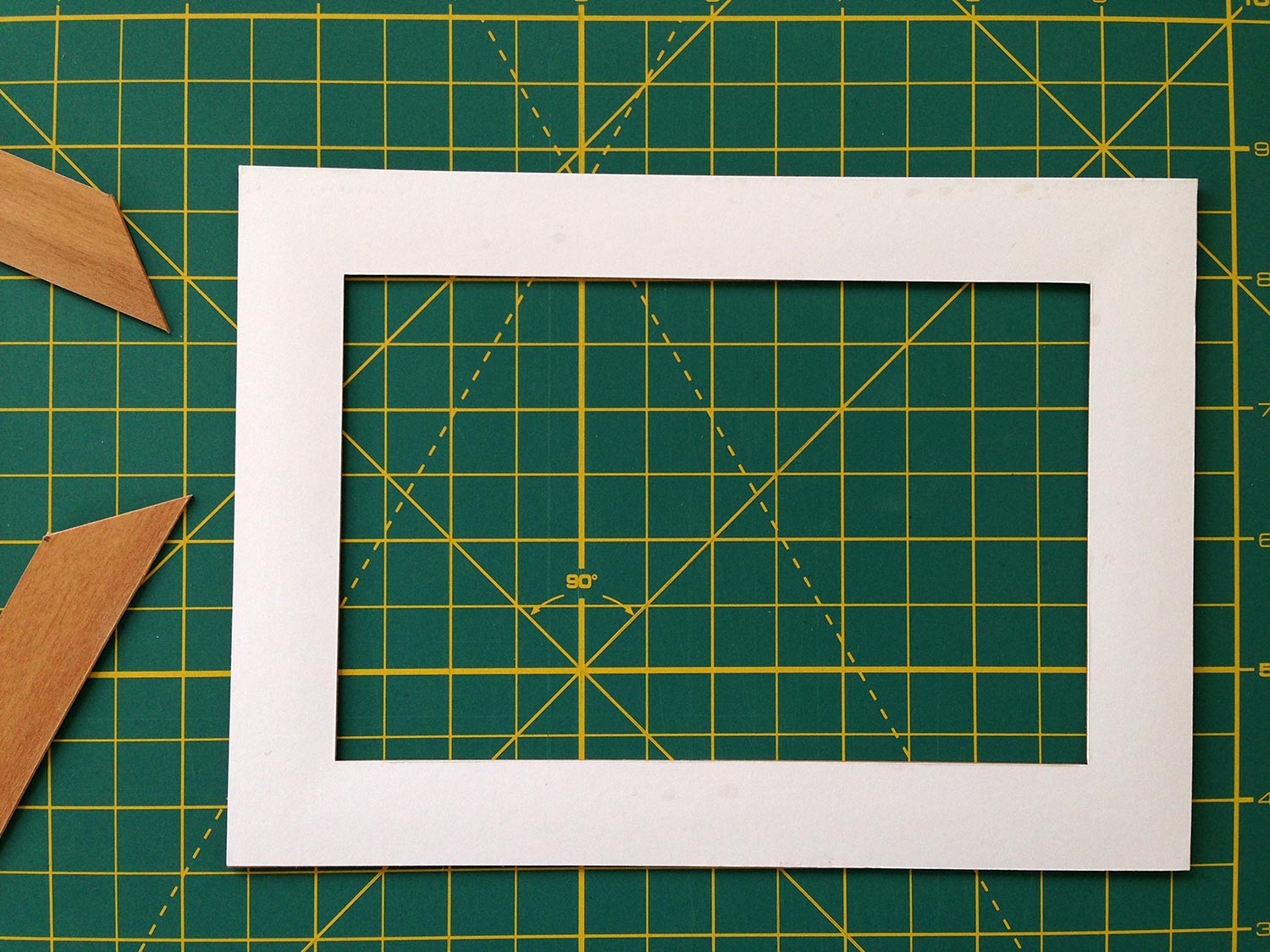 Cardboard cut to the same size as the finished frame will be